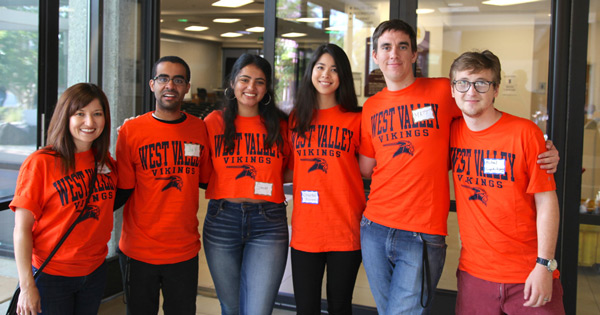 Group of students wearing orange West ʮϲ shirts